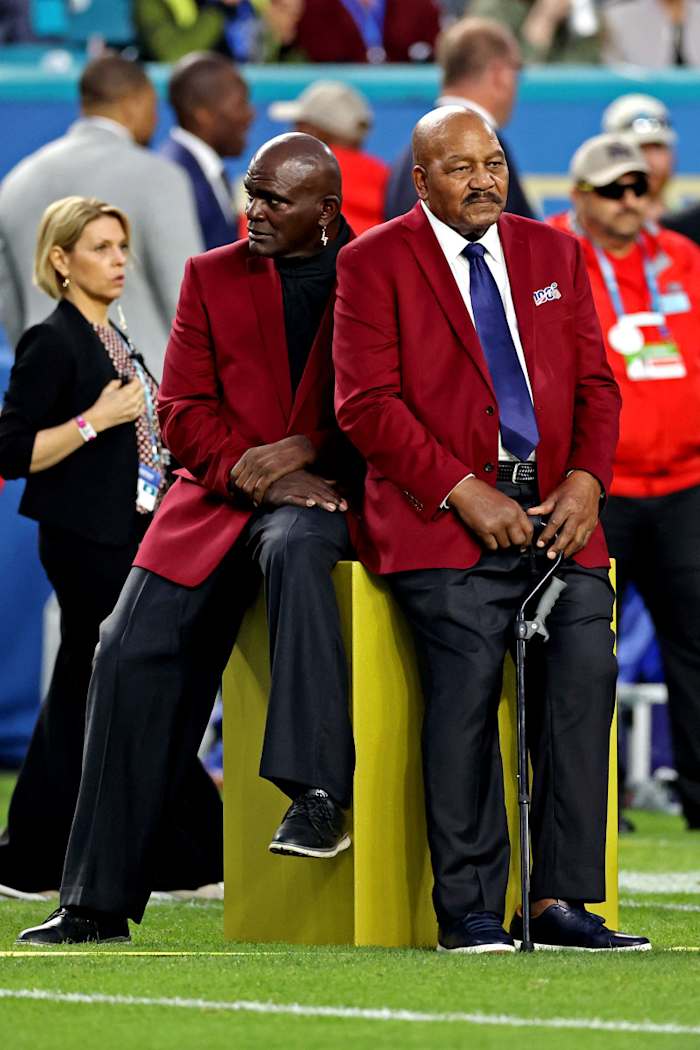NFL 100 All-Time Team members Lawrence Taylor (left) and Jim Brown before Super Bowl LIV between the 49ers and the Chiefs at Hard Rock Stadium, Feb. 2, 2020